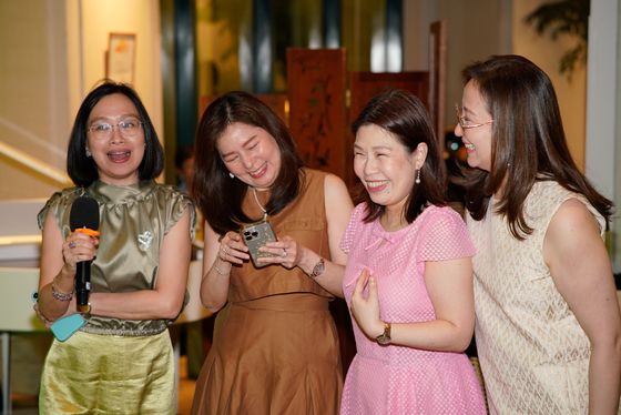 Friends laughing together at a celebration