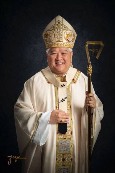 A bishop in full vestments holding a crozier